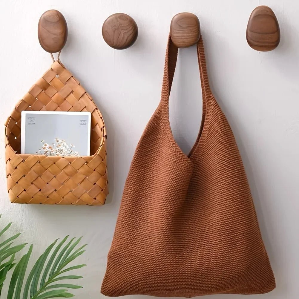 The Quartet wooden wall hooks by Oak & Origin.